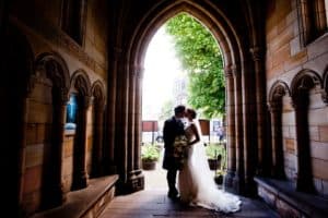 a couple in their wedding photograph at holy trinity church st andrews