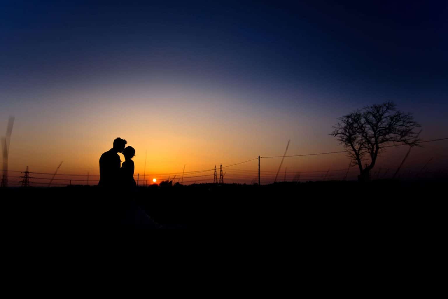 scottish wedding photographer a couple photographed against a sunset at airth castle