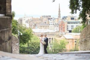 a couple overlook edinburgh in their wedding image