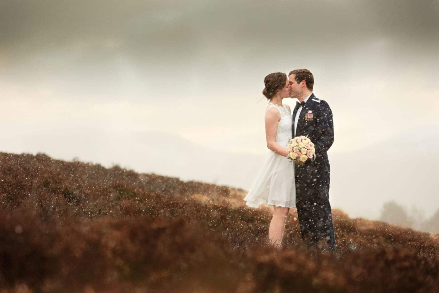 elope to scotland to get married a couple share a kiss on their elopement in aberdeesnshire