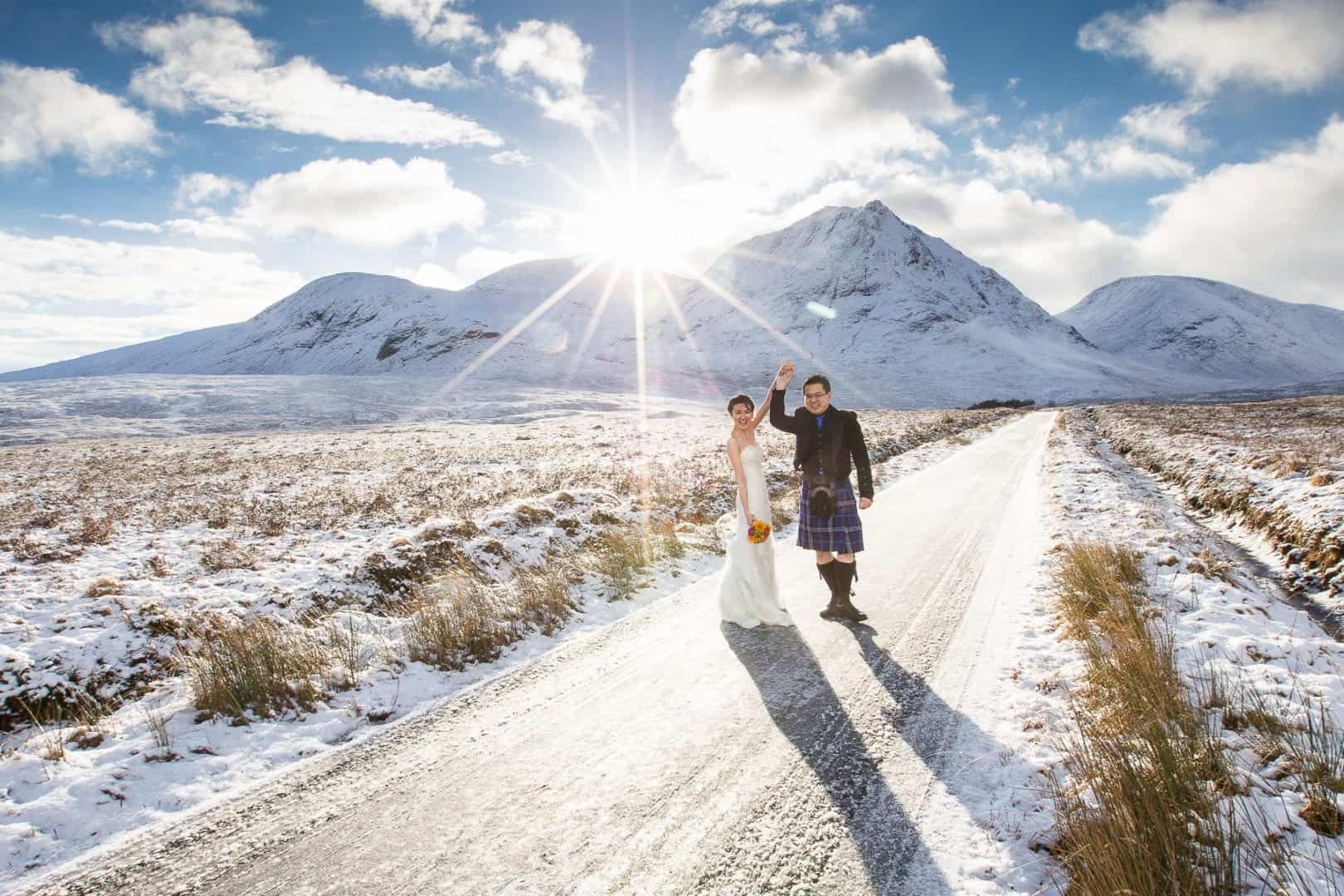 an asian couple photographed in their scottish winter wedding at glencoe