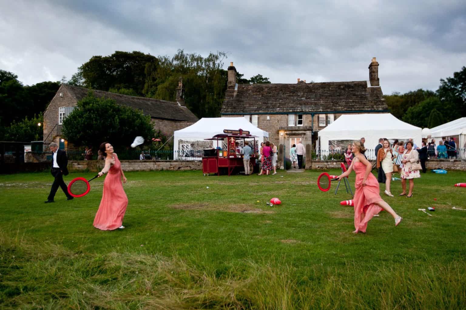 chatsworth estate weddings bridesmaids play badminto at a heathy lea weddings