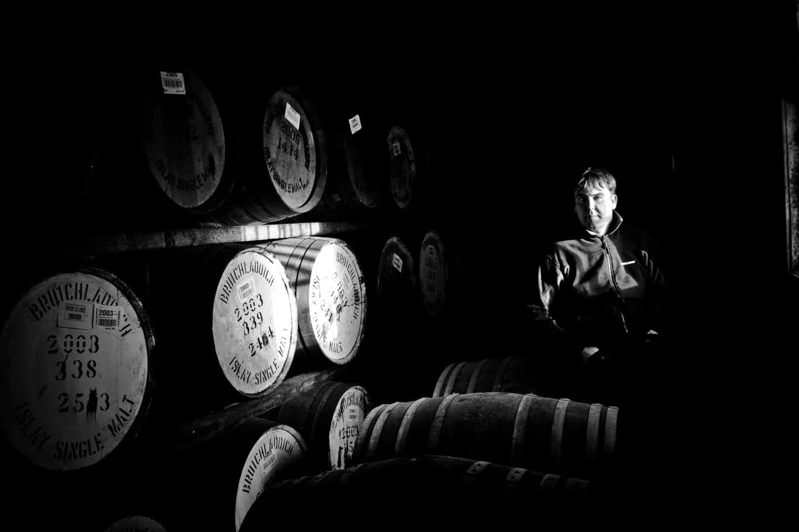 allan logan of bruichladdich distillery photographed in a warehouse on islay