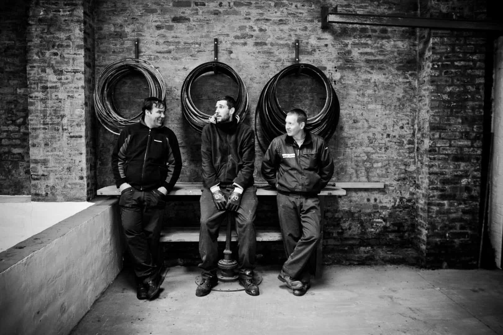 warehousemen pose for the camera at bruichladdich distillery on islay