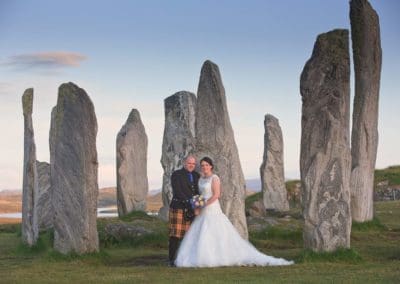 a wedding couple photographed at the callanish stones on the isle of lewis