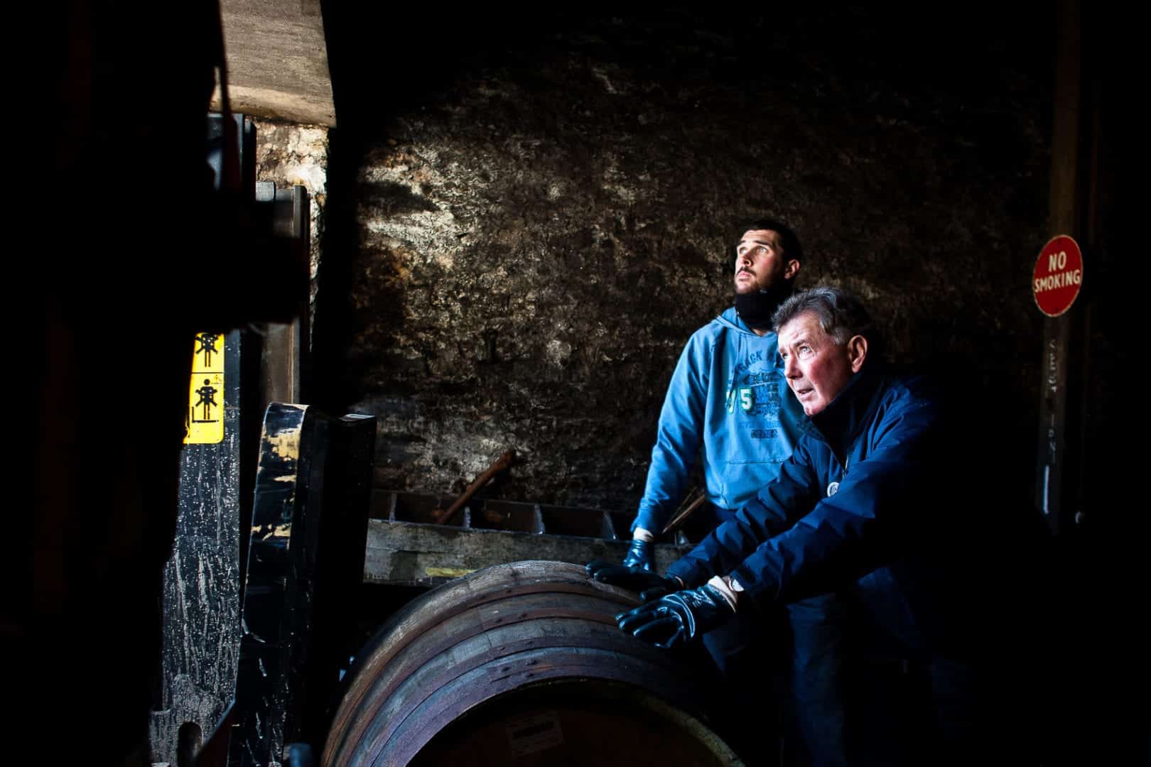 warehouse men moves barrels at bruichladdich distillery in a photo by inverness commercial photographer, roddy mackay
