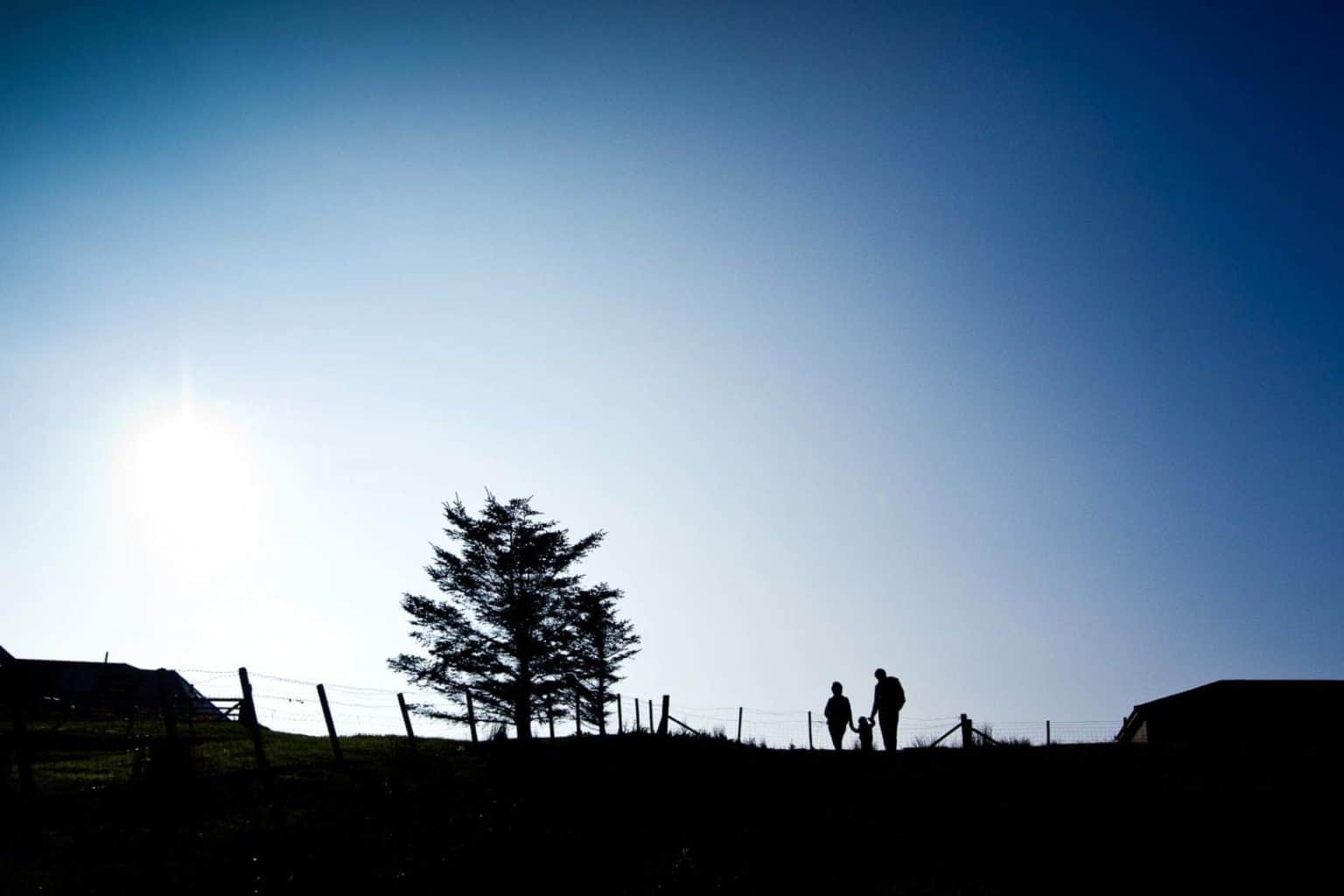 highland-family-portrait-photographer a young family walking together in their family portrait