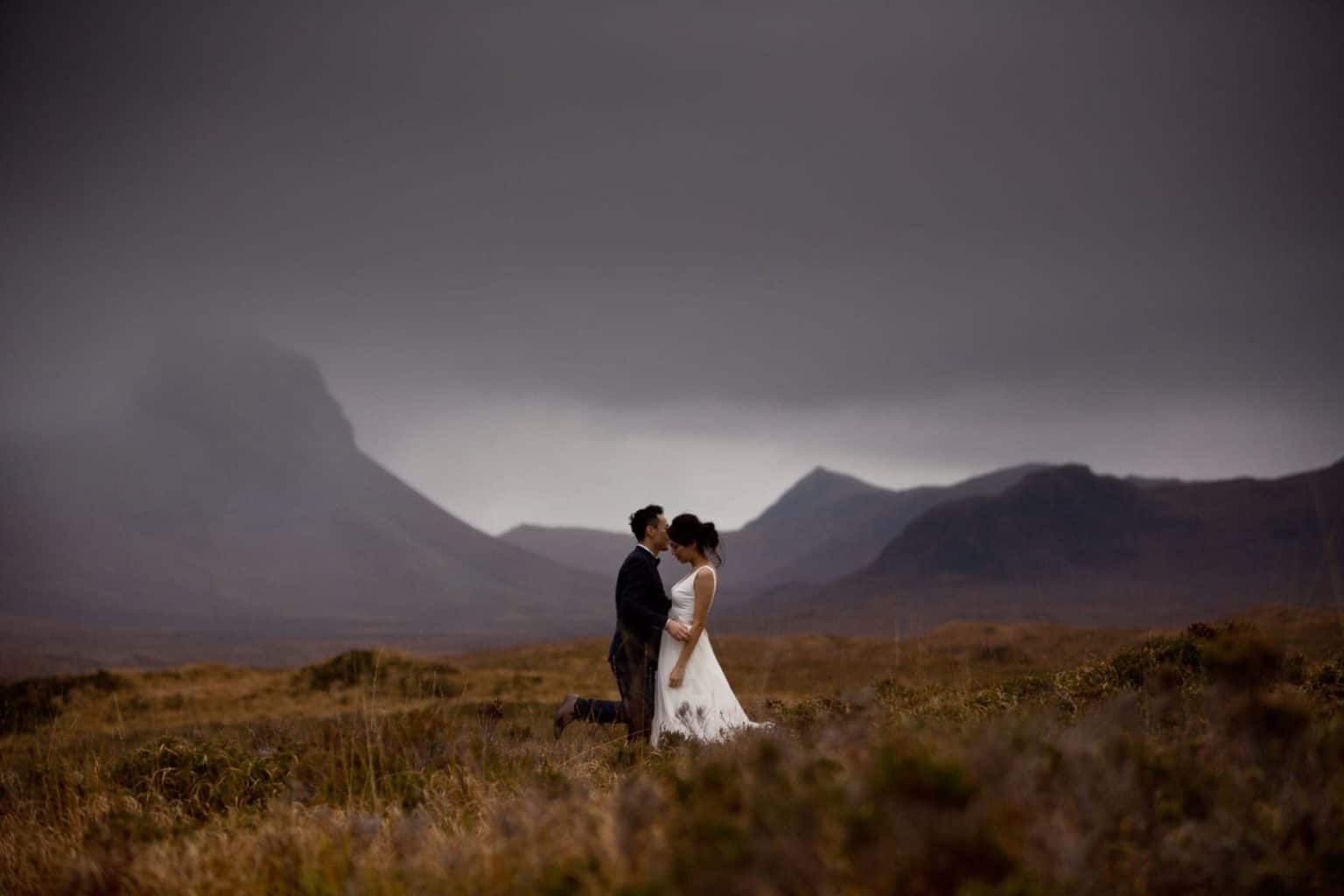 isle-of-skye-elopement a couple who chose to elope to scotland stand in a moorland on the isle of skye as part of their wedding photogrphy