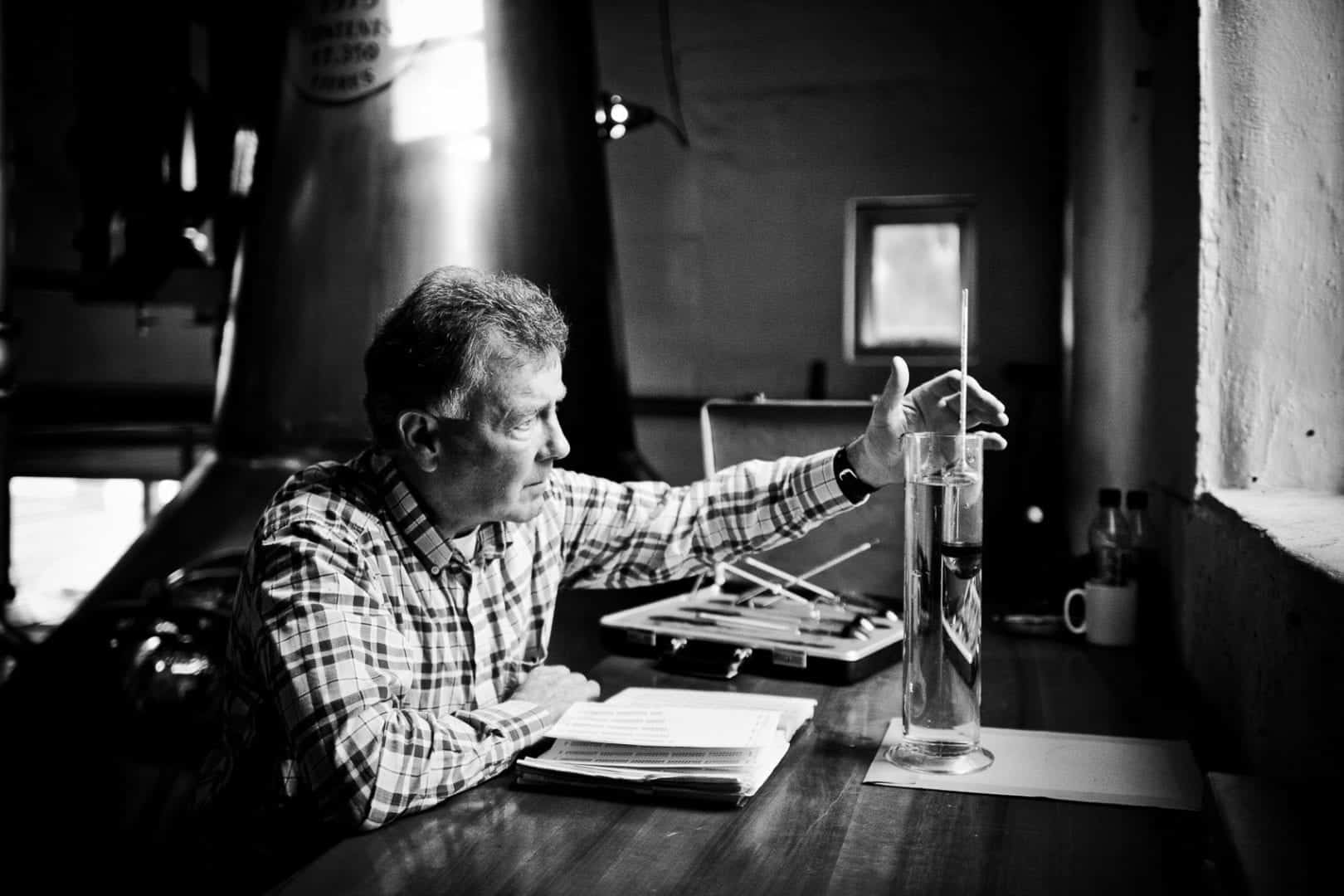 jim mcewan studying the spirit at bruichladdich distillery