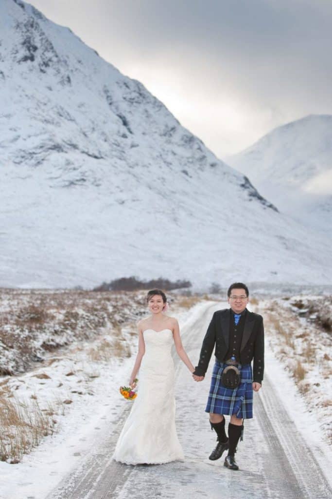 winter-wedding-photograper-scotland an asian wedding couple in the snow at glencoe on their elope to scotland