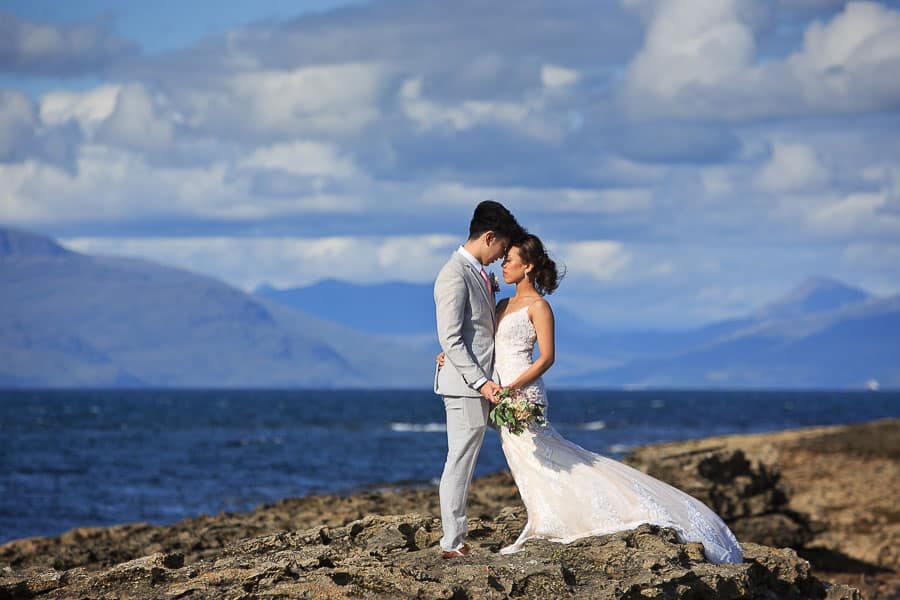 scotland-pre-wedding-08 An asian bride and groom pose for their pre wedding photo shoot on a beach in scotland
