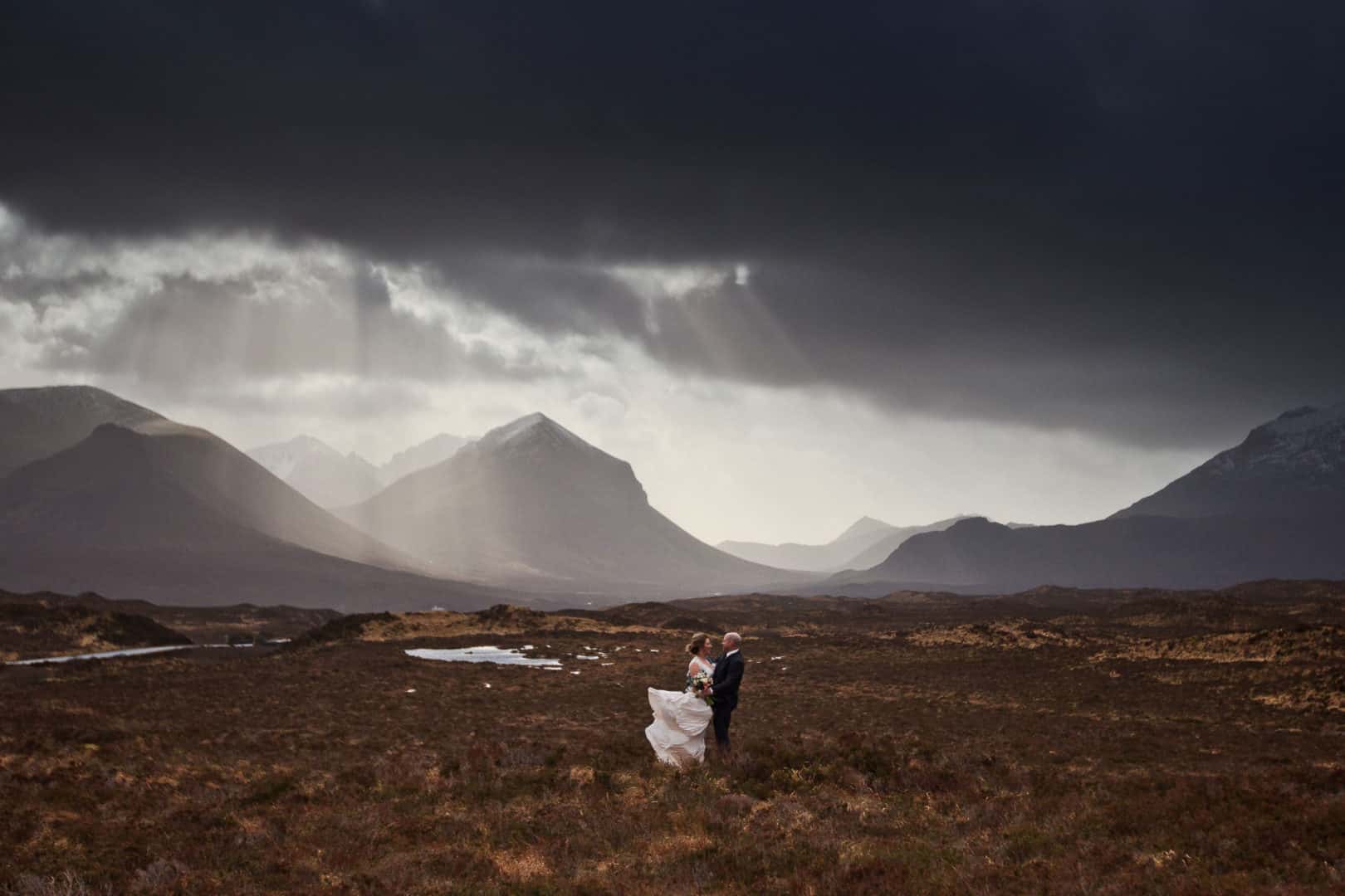 a bride and groom who chose to get married in scotland on their wedding day on the isle of skye