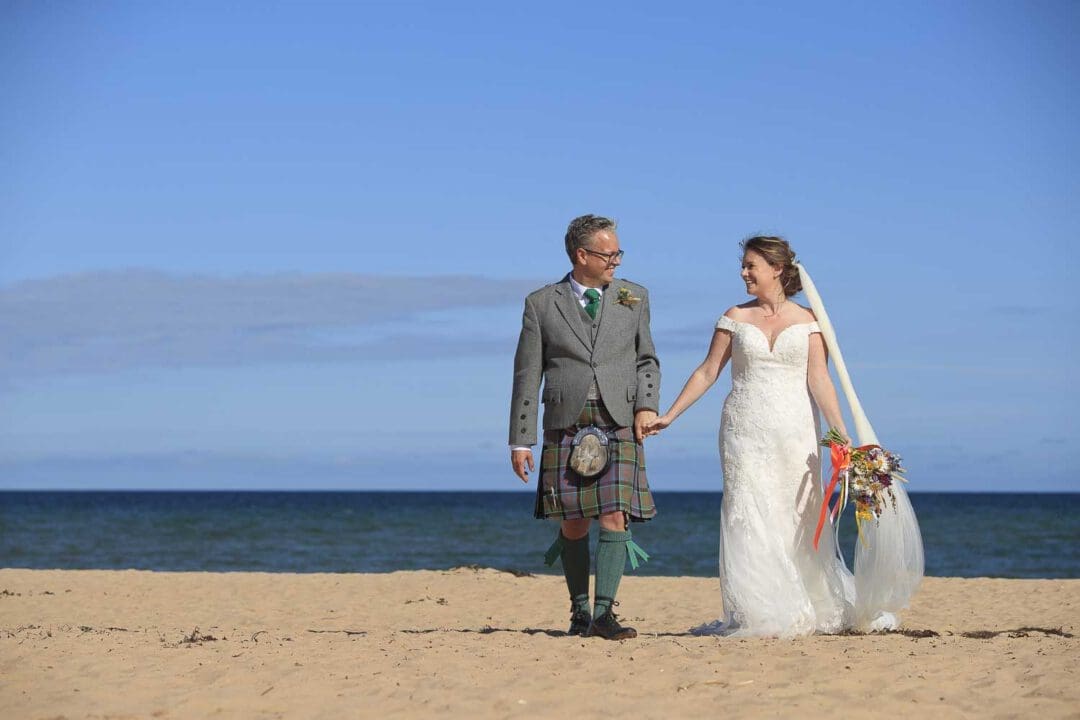 Dornoch beach wedding bridge and groom